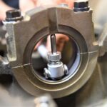 Dial bore gauge positioned inside an engine bearing housing