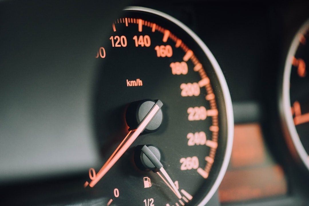 Close-up of a car speedometer showing a high-speed scale in km/h